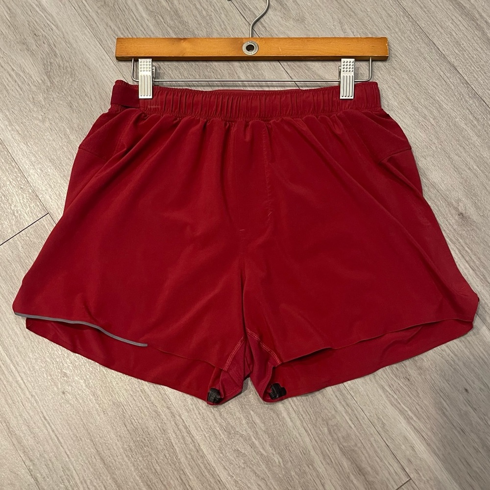 Lululemon 4” surge shorts. Built in liner. Red size Medium